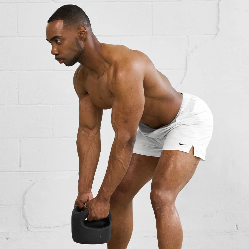 Athlete holding a Flowbell in a hip-hinge position